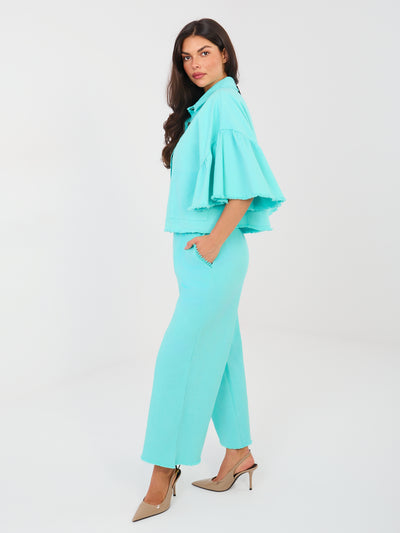 Turkusowe jeansy wide leg bez zapięcia
