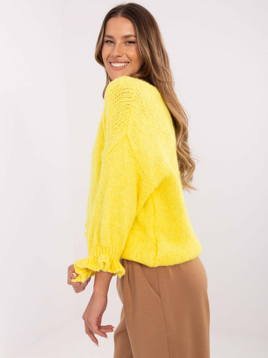 Żółty damski sweter oversize w jednolitym kolorze