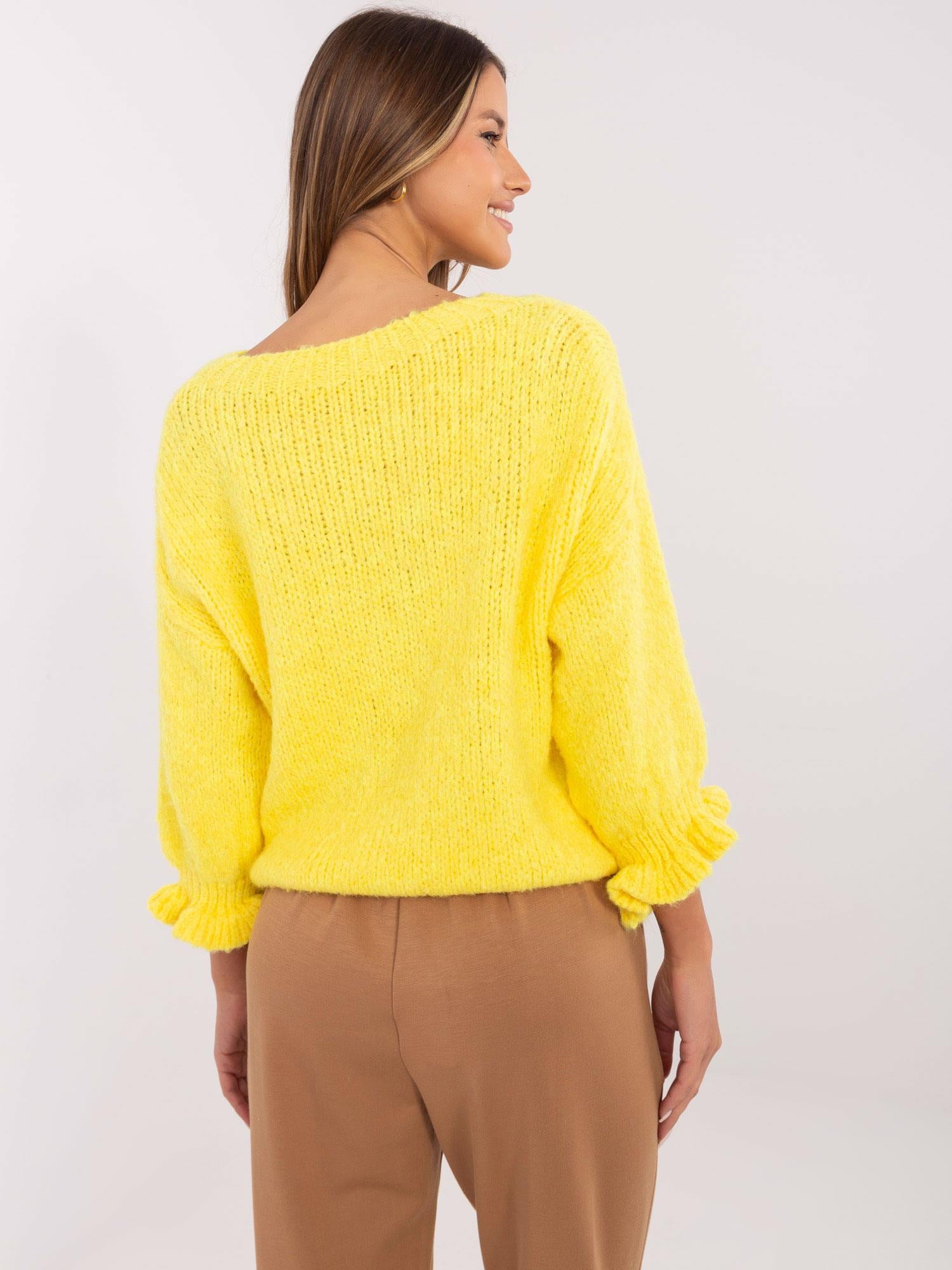 Żółty damski sweter oversize w jednolitym kolorze